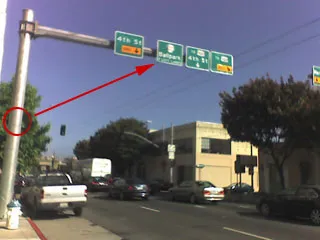 The “Ball Park” street sign was relocated from behind the pole to atop the pole’s extension, making the sign much more visible