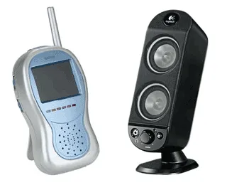 A video baby monitor next to a Logitech X-230 speaker