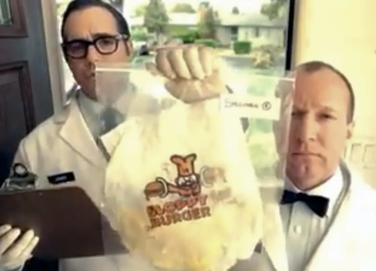 Two scientists at someone's front door, accusingly holding up a baggie with trash in it