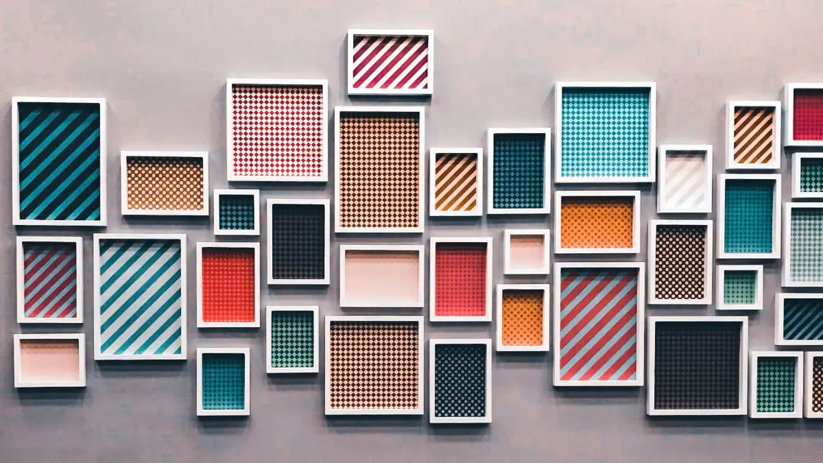 A group of picture frames hung on a wall