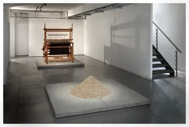 Alastair Mackie’s “untitled (+/-)” exhibited at the Museum of Arts & Design in New York City. It is a conical pile of barn owl pellets.
