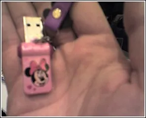 A tiny USB stick with Mini Mouse on it